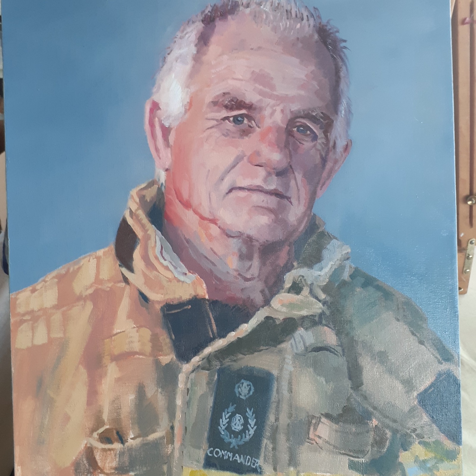 Oil portrait of a man in uniform, titled Commander