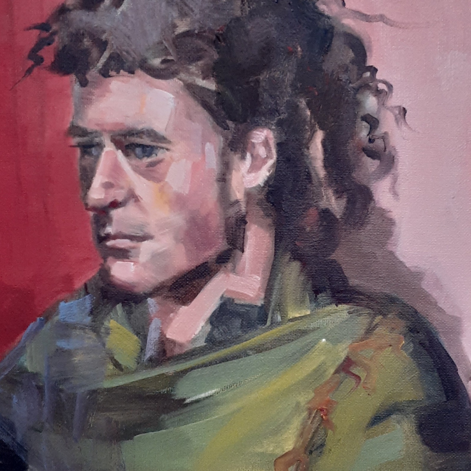 Oil portrait of a young man against a red background